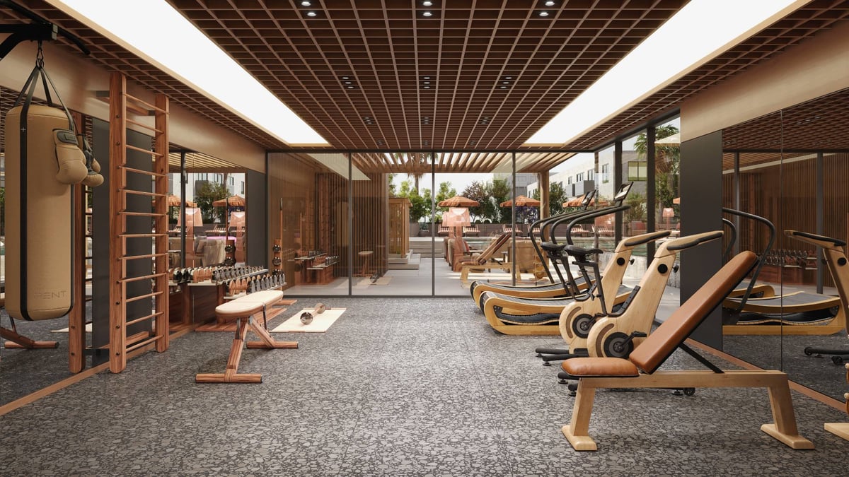Almaan 101 — The gym opens towards the pool, bringing the building's fitness spaces together.