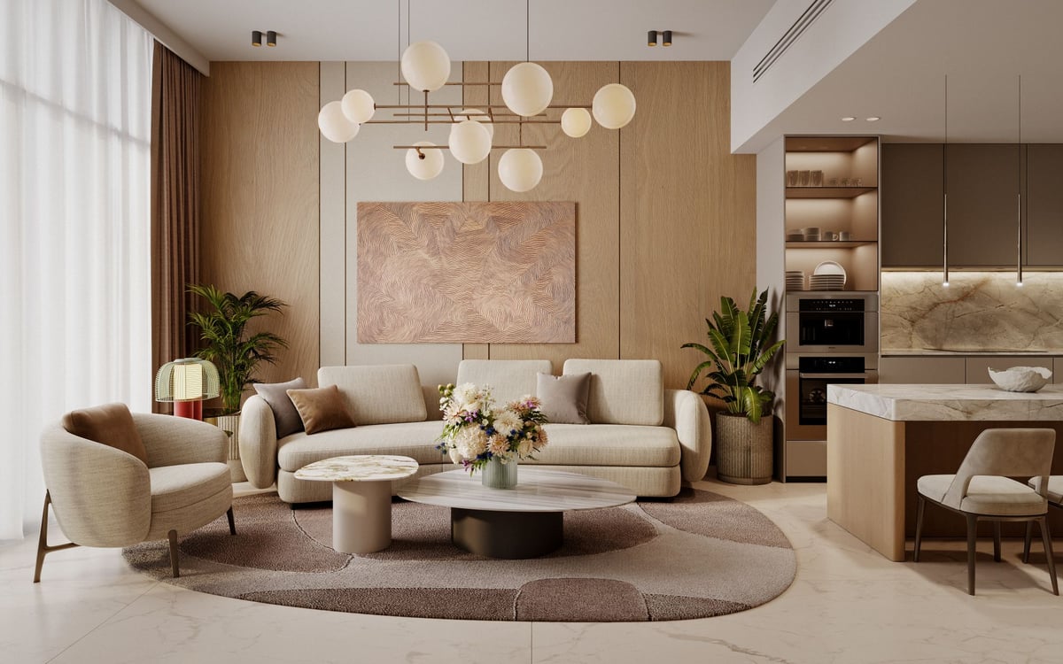 Almaan 101 — The living area shares daylight with the kitchen, making the most of a compact apartment plan.