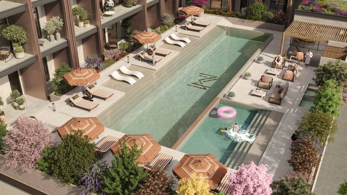 Almaan 101 — Seating follows both long edges of the pool, leaving the water as the courtyard's organising element.