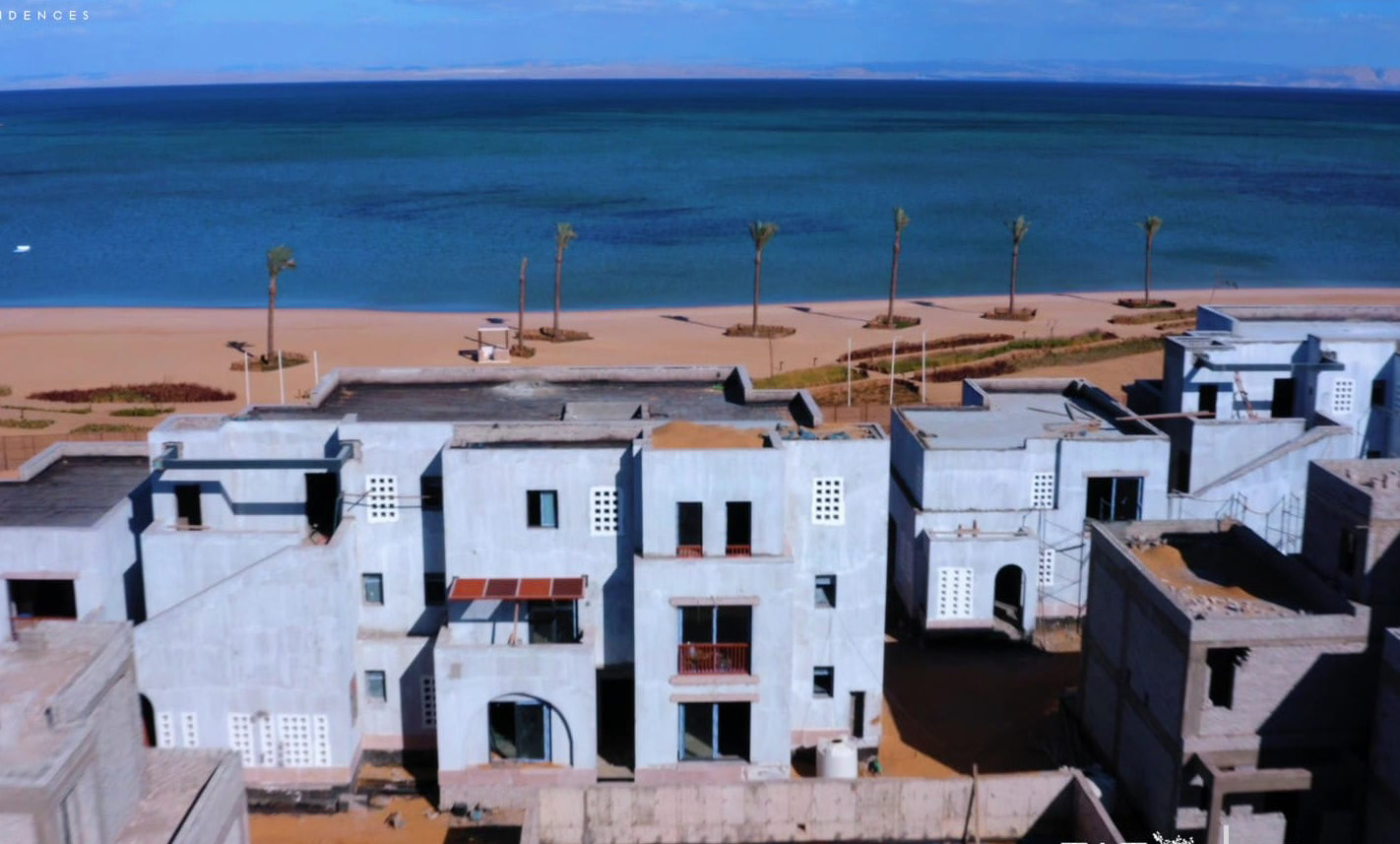 Can Limon, Kai Sokhna — Render — the built shells from the beach road