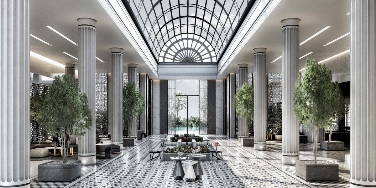 Costa Mares — The vaulted glass roof turns the lobby's central route into a daylit interior promenade.