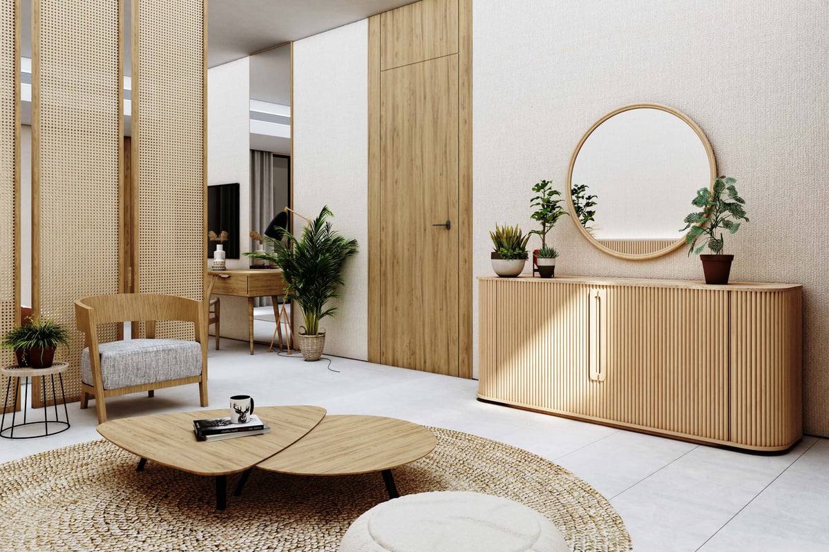 Costa Mares — The suite separates a place to sit from the bedroom while carrying the same pale timber throughout.