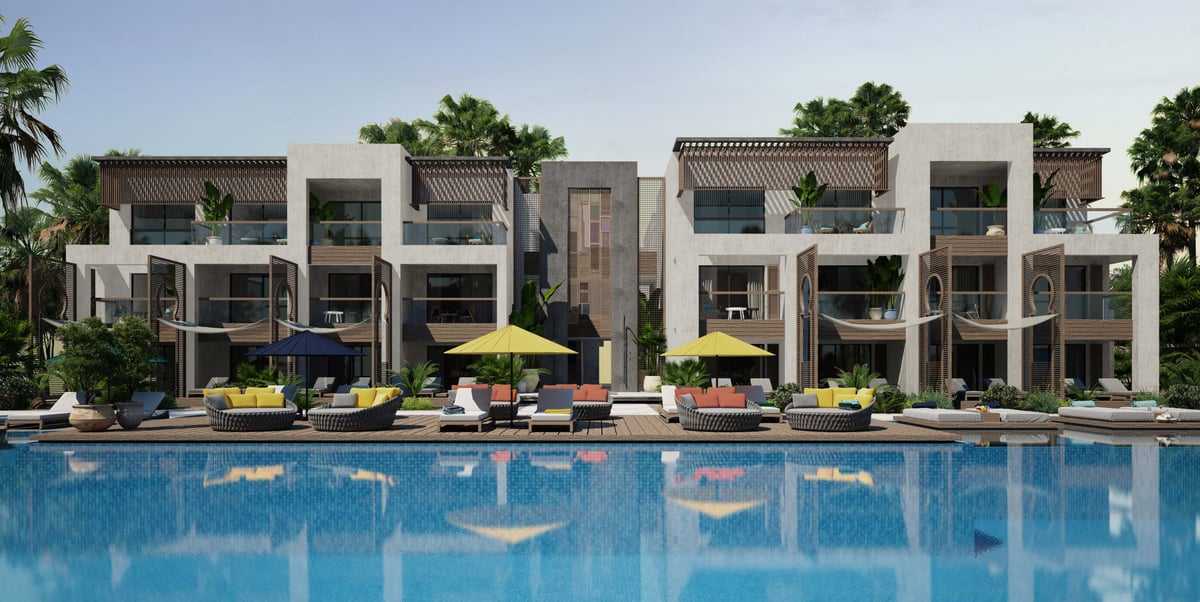 Costa Mares — Colour enters through loose furnishings, leaving the building's pale surfaces as a consistent backdrop.