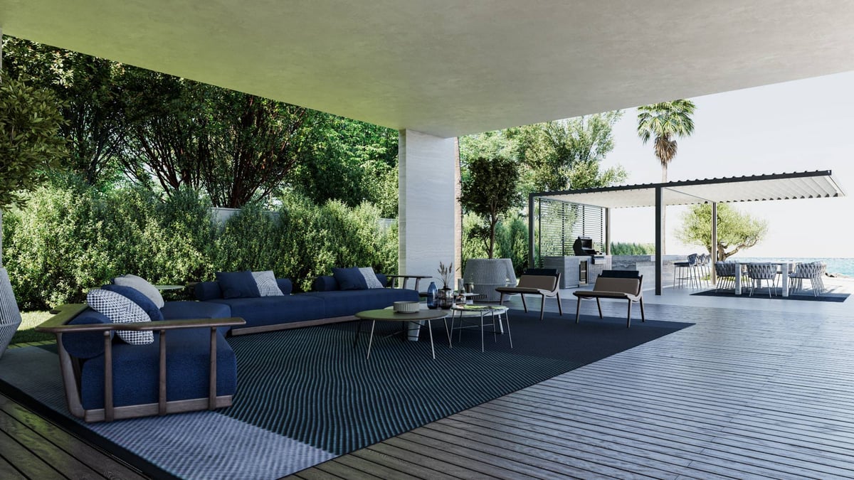 La Mer C1 — The covered lounge sits under the cantilever, shaded, with the sea at the end of the view.