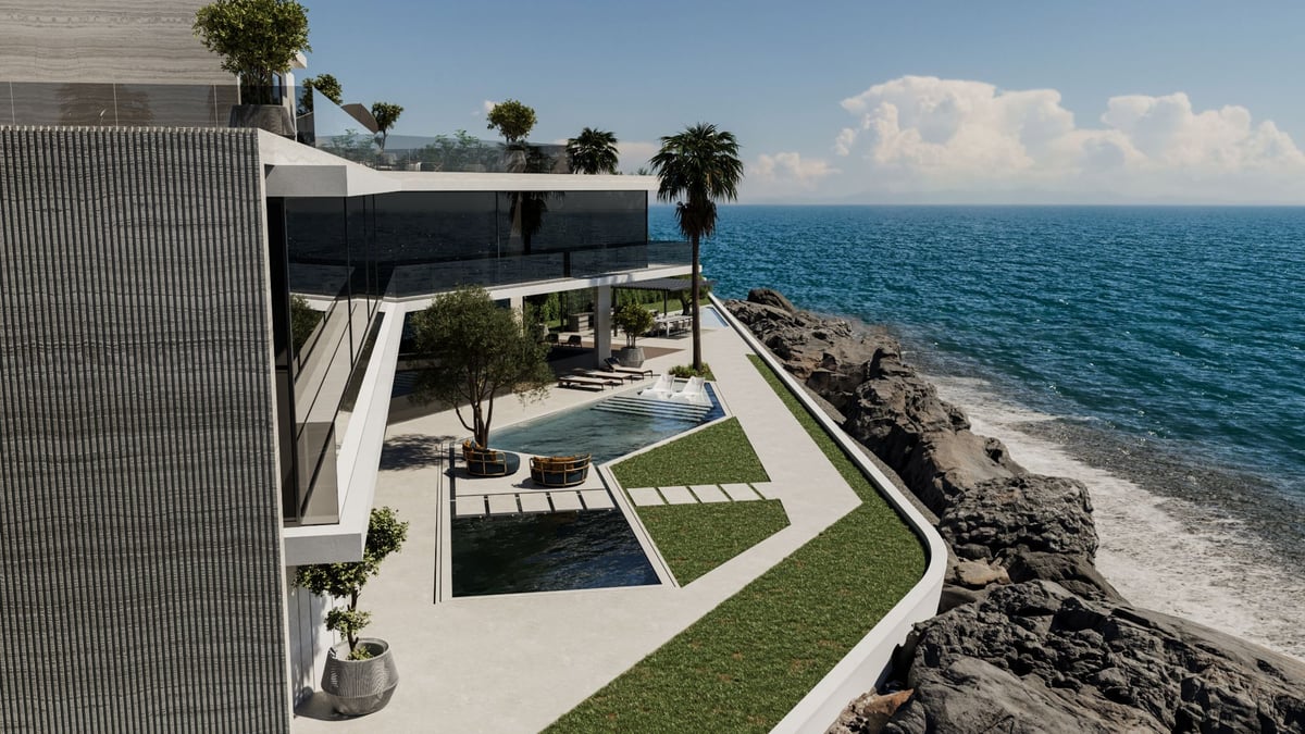 La Mer C1 — The pool terrace follows the line of the rock edge, with the sea directly beyond.