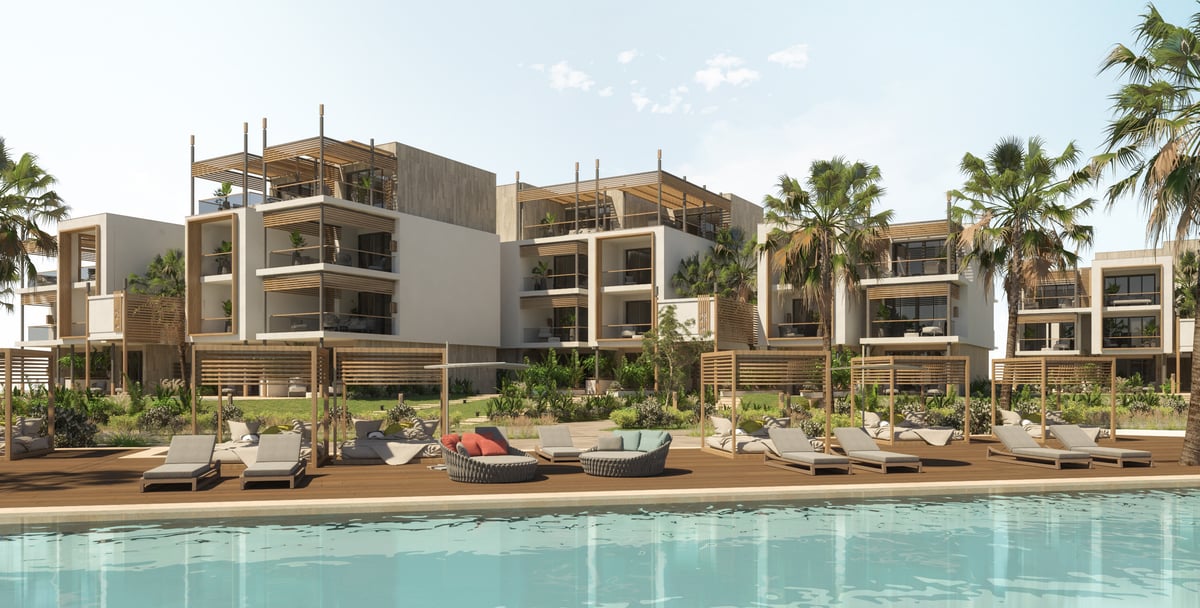Rixos Magawish — The pool deck forms a shared foreground to the more private room terraces.