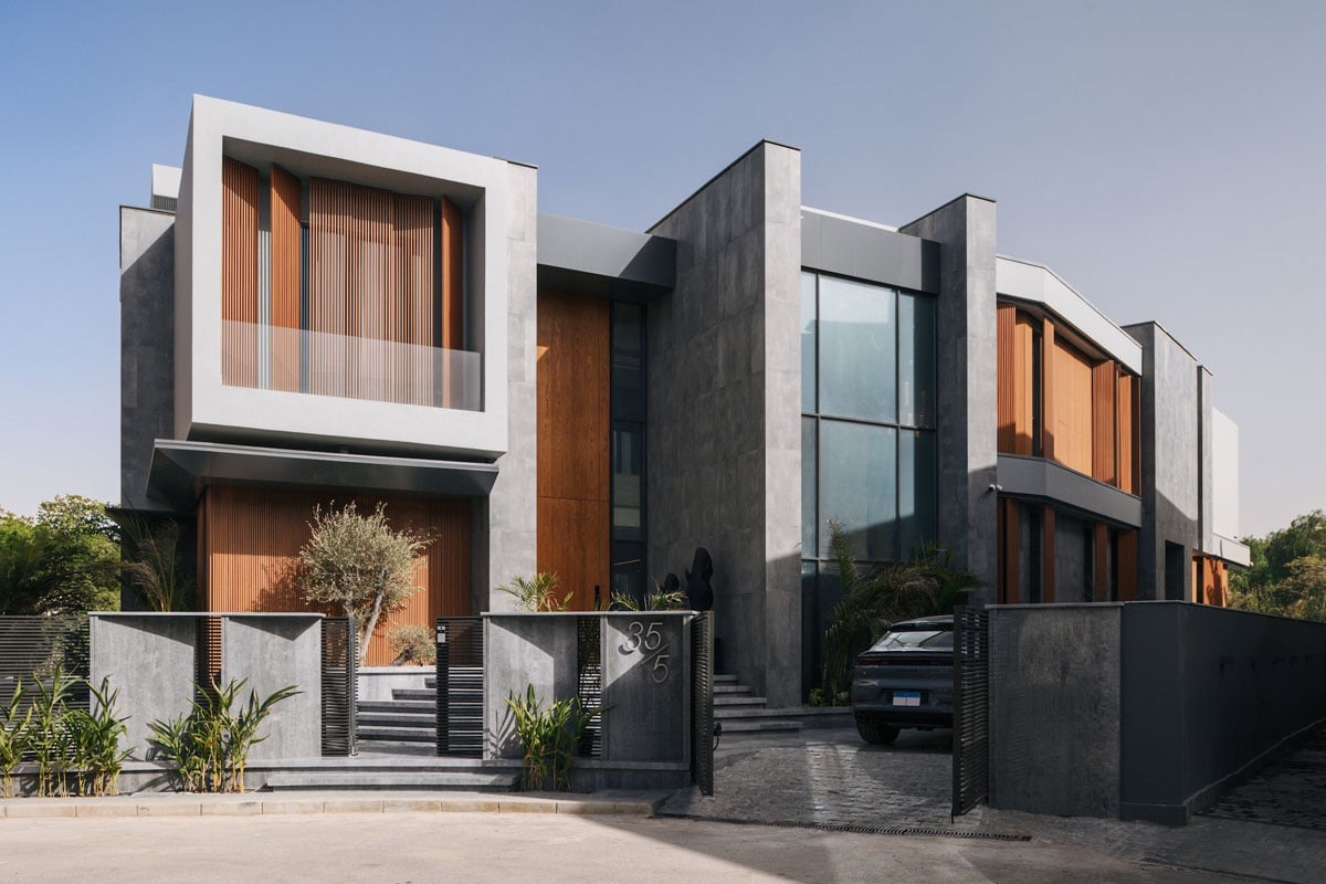The Continuum House — Street front — the entrance, cantilevered box and garage court