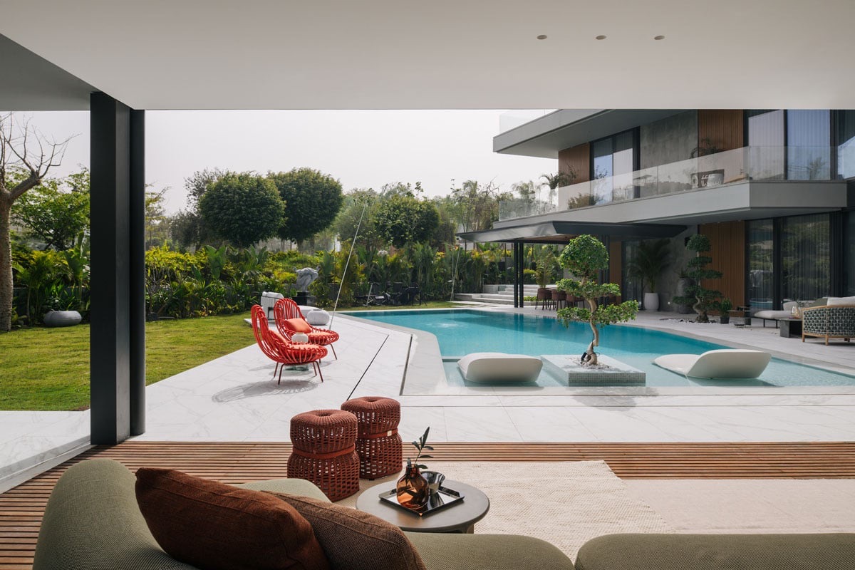 The Continuum House — Lawn and pool terrace looking back to the house