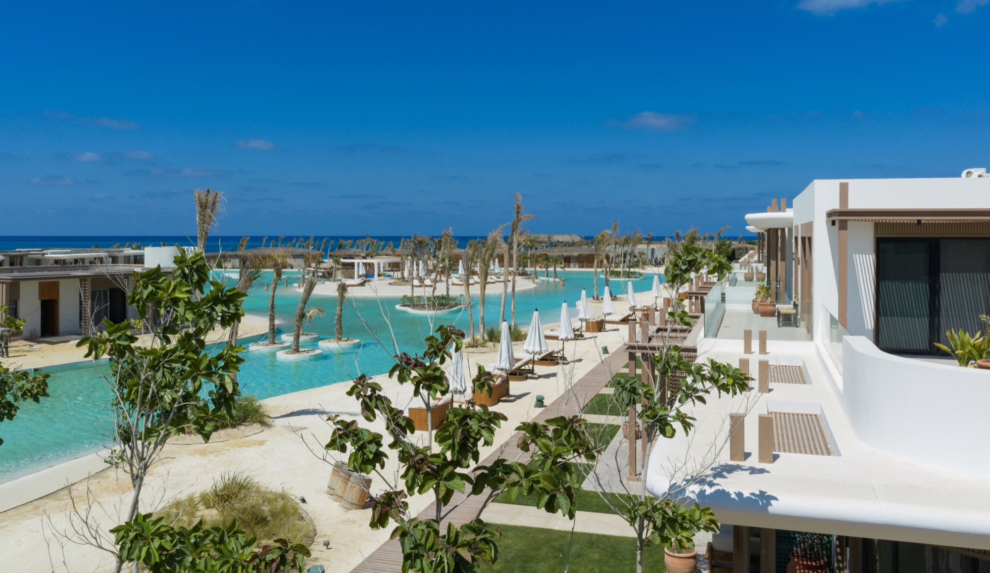 Zoya Ghazala Bay — Lagoon-side planting and terraces